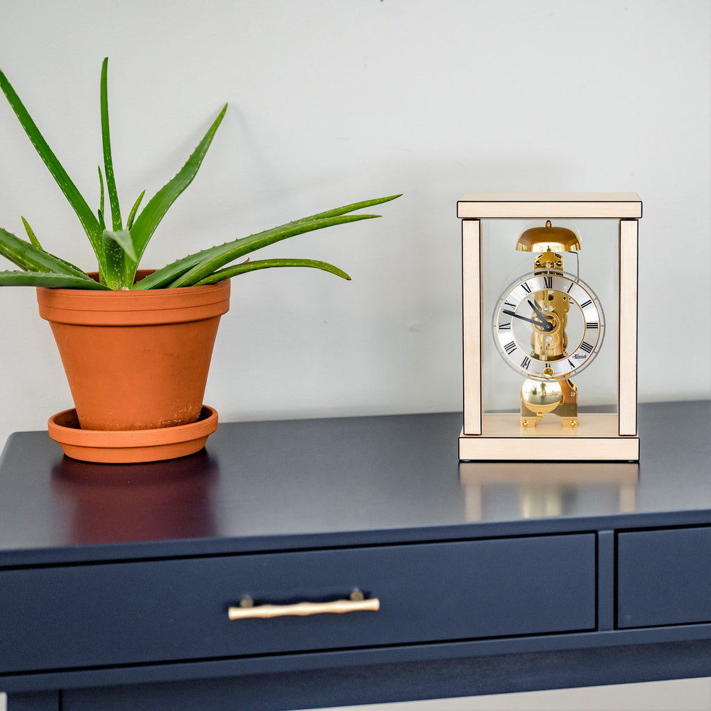 Classic four-pillar walnut case mechanical table clock