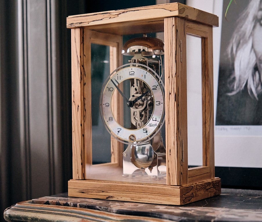 Classic four-pillar walnut case mechanical table clock